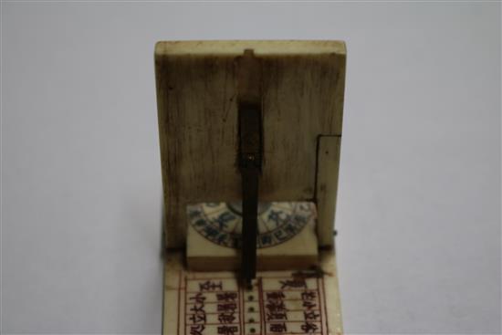 A Chinese ivory zodiac compass, a puzzle ball and a 19th century carved matchstick